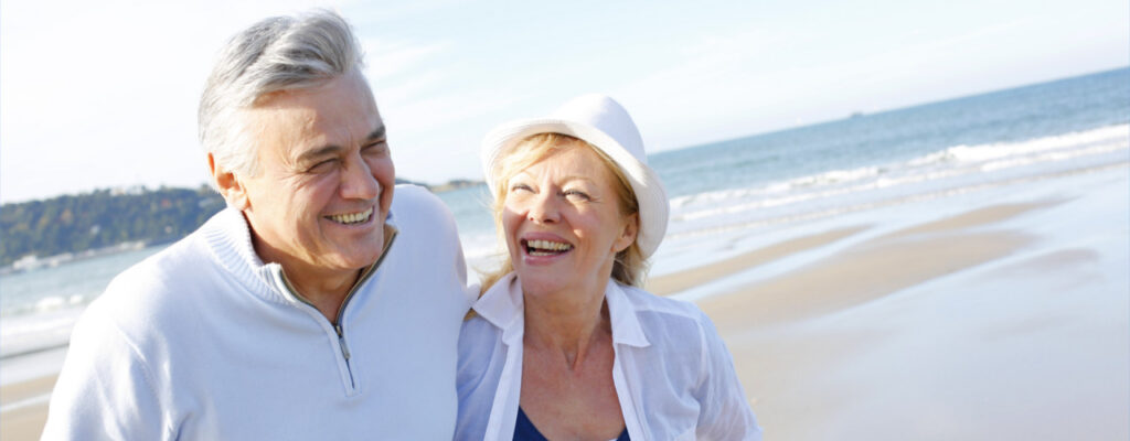 happy couple couple at the beach lumina wellness and physical therapy